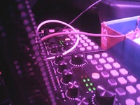 a dj mixer in a dark room